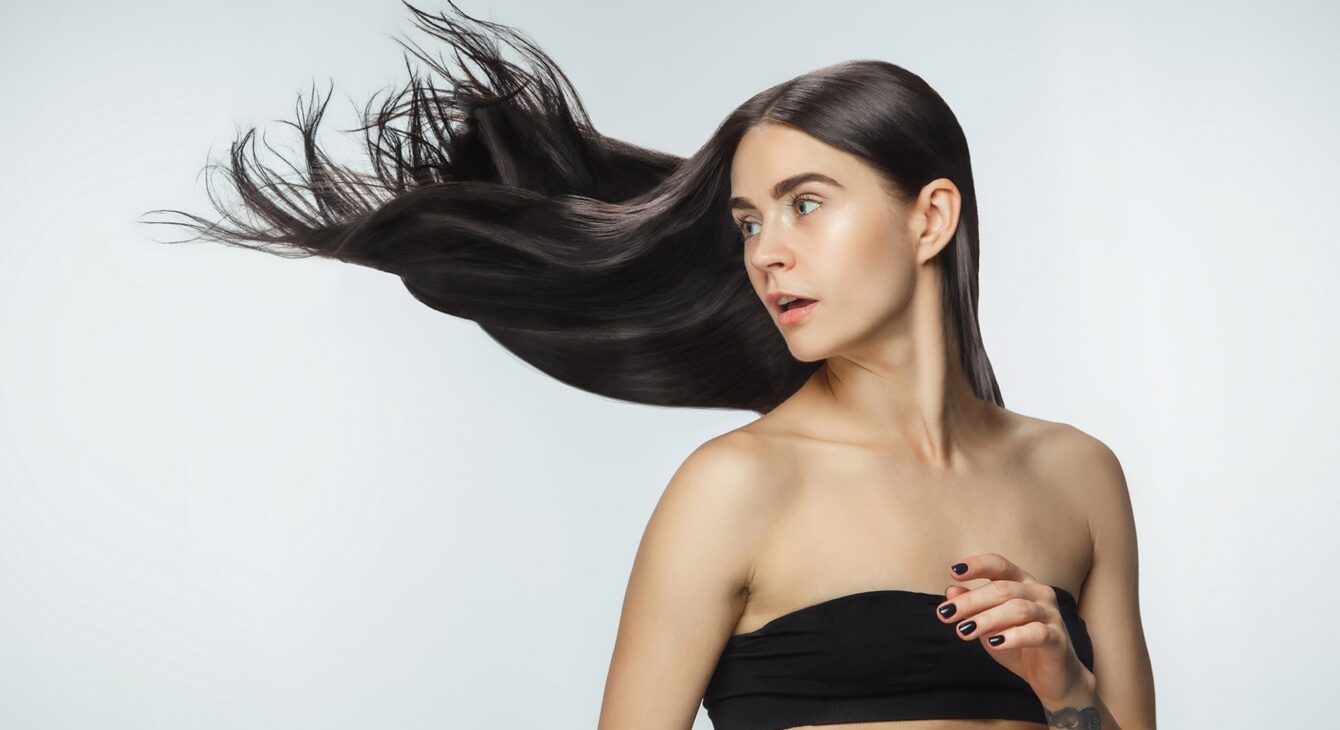 beautiful-model-with-long-smooth-flying-brunette-hair-isolated-white-studio-background